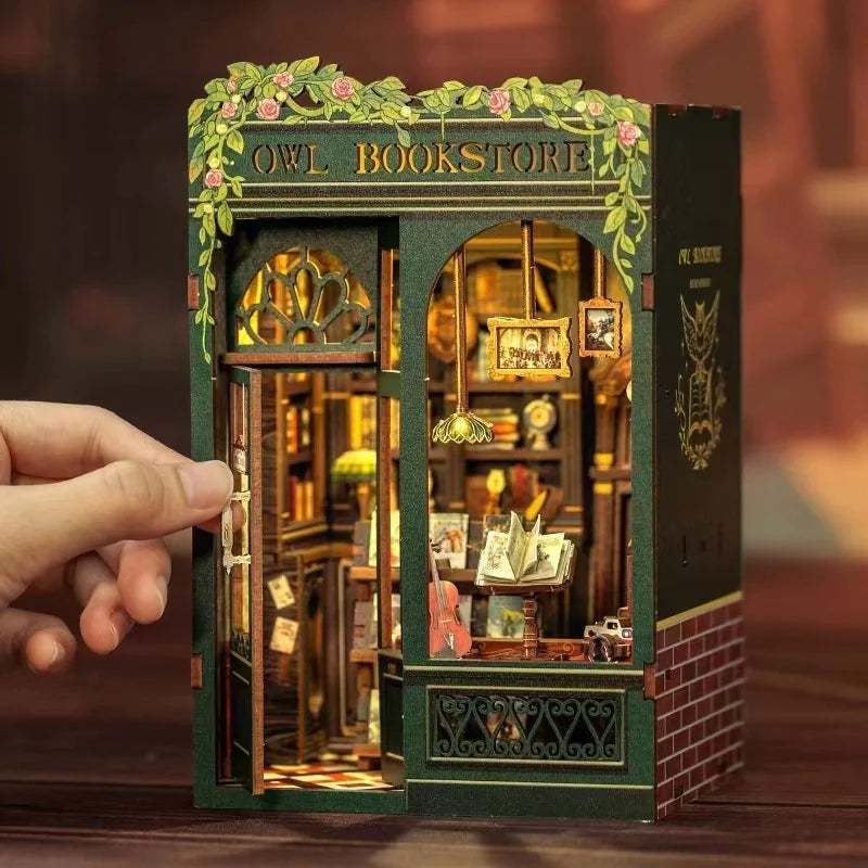 Assembled owl bookstore book nook between real books
