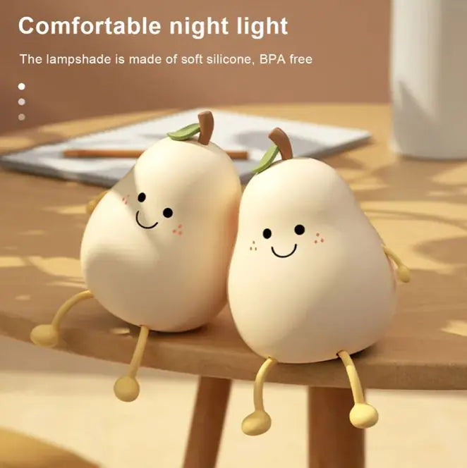 Cute LED pear night light illuminating softly