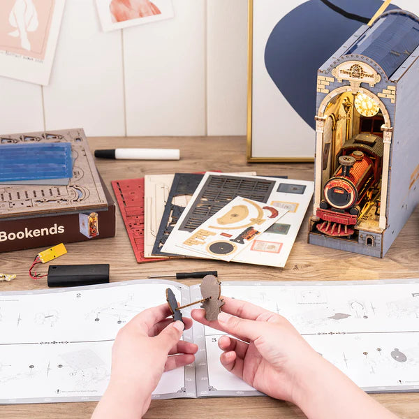 Handcrafted DIY book nook with train and time portal details