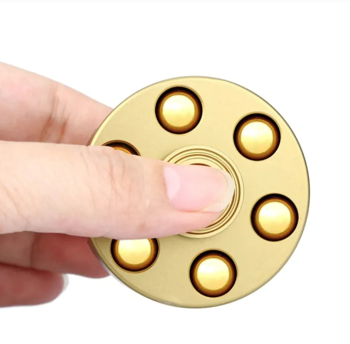 Brass spinner toy with detachable and reloadable bullets