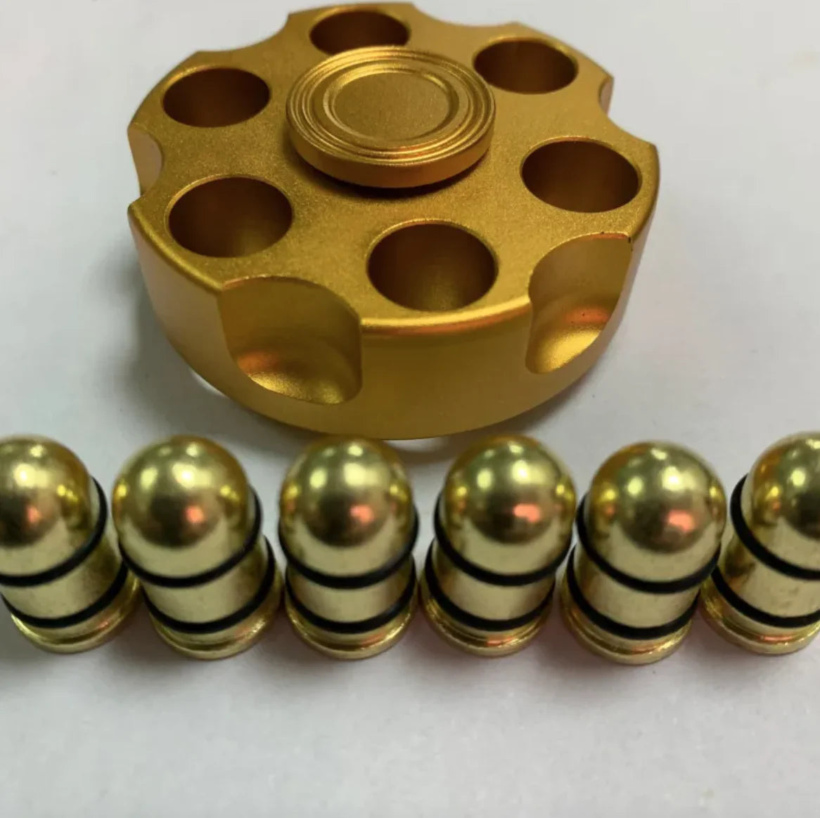 Cowboy-themed brass spinner fidget toy on desktop