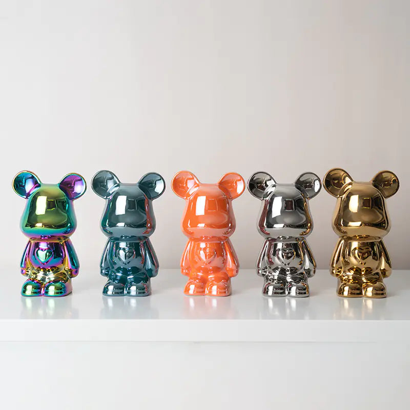 Front view of glossy bear ornament with sculptural detailing