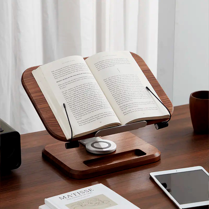 Ergonomic walnut wood reading stand holding open book on desk