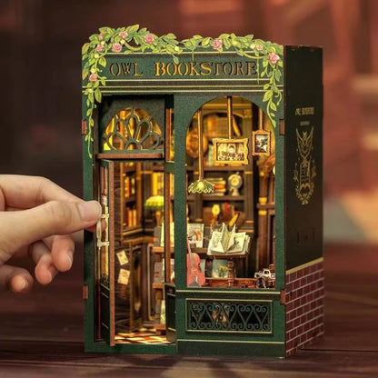 Assembled owl bookstore book nook between real books