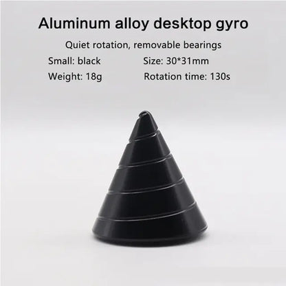 Elegant metal spinner cone placed on wooden desk