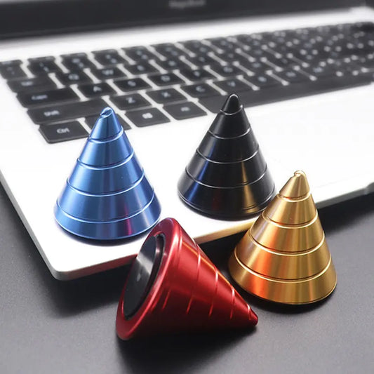 Sleek metal desktop spinner cone spinning on desk