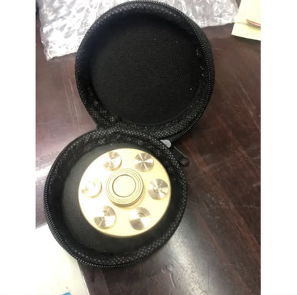 Revolver-style spinner with detachable bullets for interactive play
