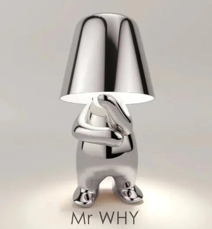 Silver thinker statue lamp sitting with hand on face